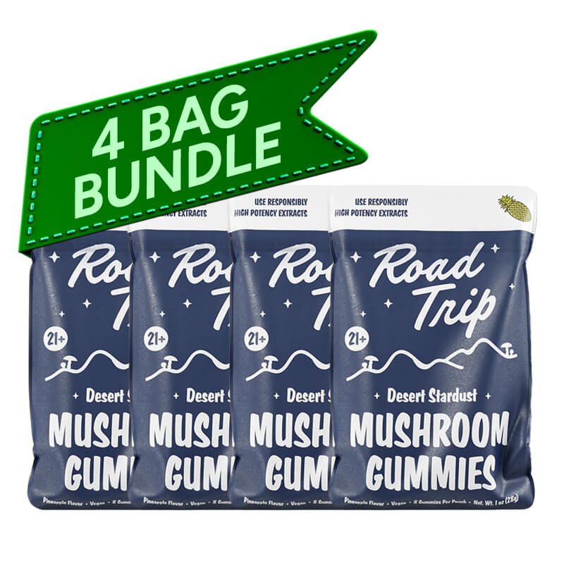 Four packs of Road Trip Desert Stardust Mushroom Gummies with a green banner indicating a 4-pack bundle.