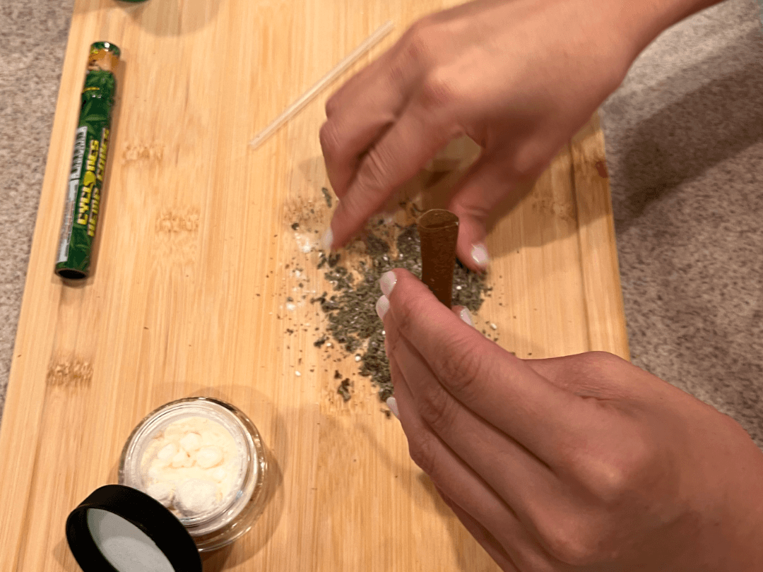 another step in the process of rolling a blunt with THCA crystals