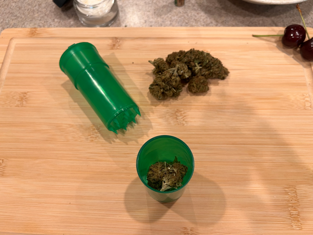 this is the first step to rolling a THCA blunt, put your cannabis into a grinder 